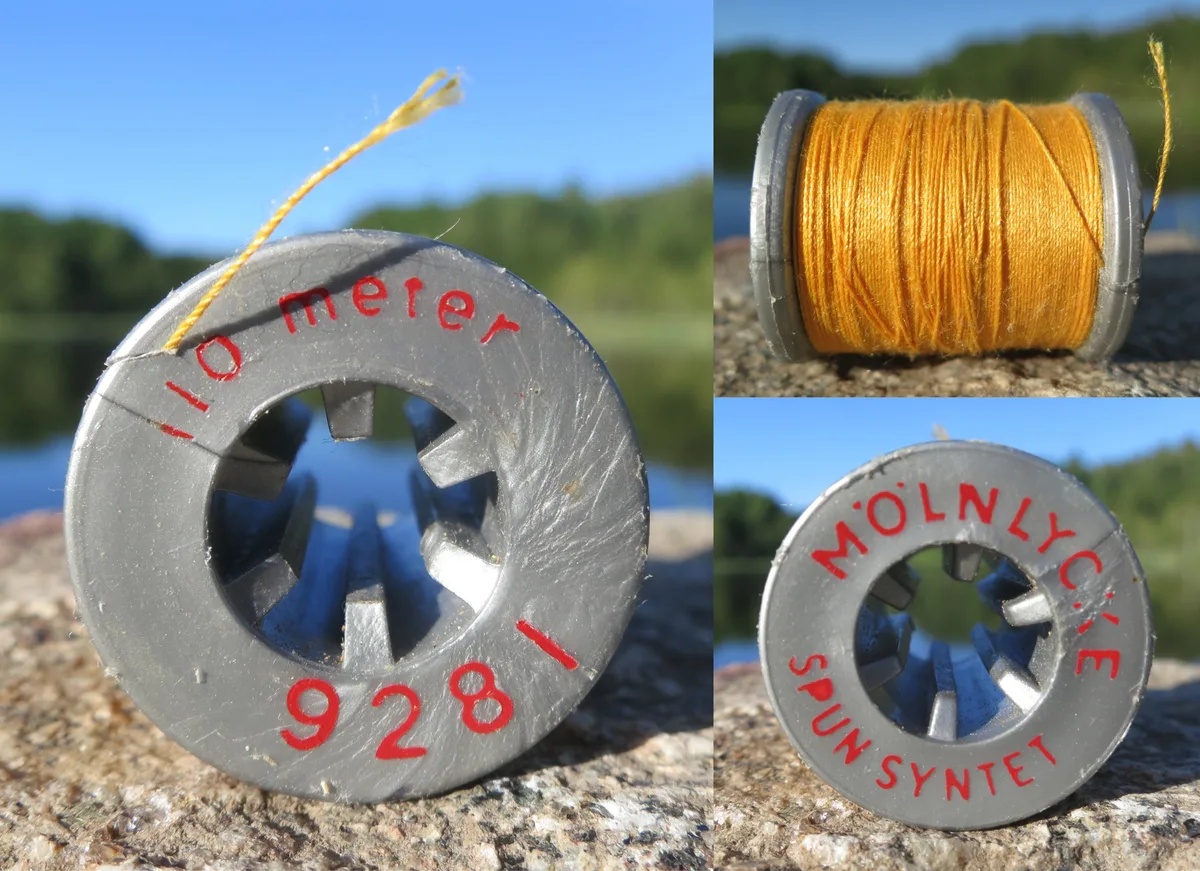 Bobine de fil à broder orange posée en extérieur, prête pour un projet d'upcycling textile